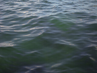 Turquoise sea in calm close-up. Beautiful background, resort