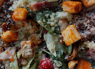 Caesar salad with grilled chicken meat, fresh lettuce, parmesan cheese and fried croutons.