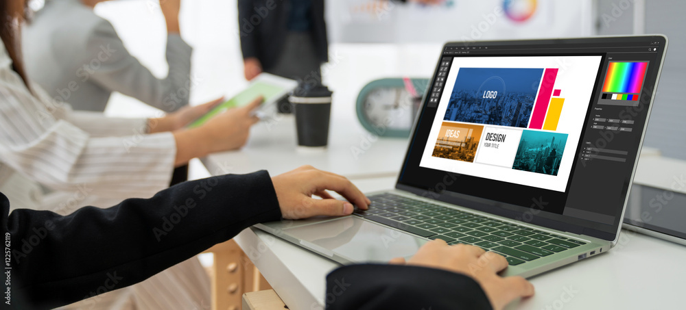 Wall mural graphic designer software for modern design of web page and commercial ads showing on the computer s