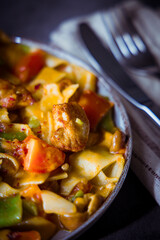chicken strips with tagliatelle and vegetables. Selective focus.
