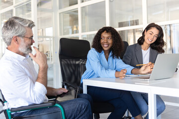 Energetic manager collaborating with ambitious team of diverse professionals