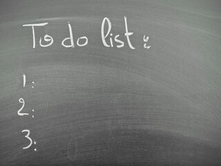 Handwritten to-do list on gray chalkboard background with empty numbered items ready for filling in tasks or goals