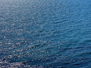 Glittering blue sea water surface.