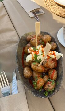 grilled potatoes with aioli and green onions