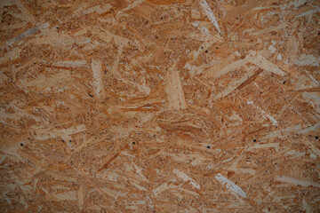 Textured surface of oriented strand board in natural light