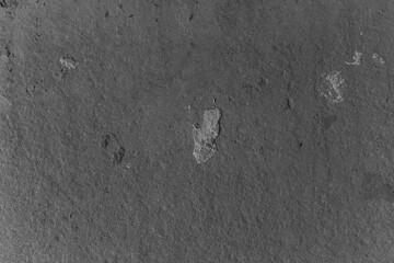 Uncovered ancient petroglyphs on rocky surface in historic site