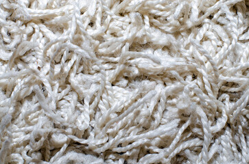 Close-Up of White Textured Yarn Fibers: Soft and Tangled Details