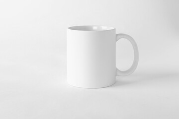 Obraz premium One blank mug on white background. Mockup for design