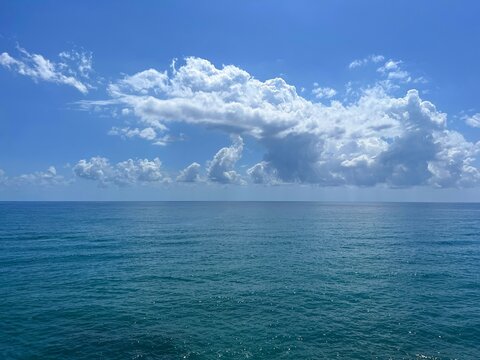 Ocean calm water and cloudy heaven horizon.