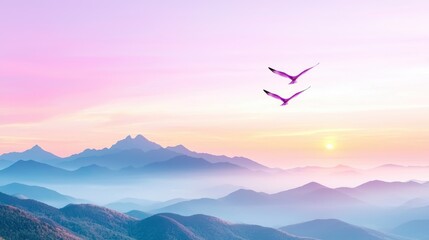 Pink birds fly over misty mountains at sunrise; peaceful landscape for travel brochures