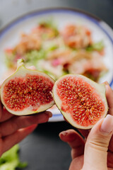 Close-up of fresh, ripe figs split in half showcasing their vibrant and juicy interior texture