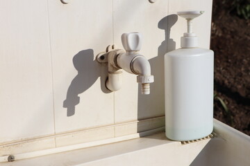 A Modern Faucet and Soap Dispenser Displayed in a Clean and Neat Setting for Use