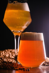 Variety of beer glasses with different types of beer on wooden table. Close-up.