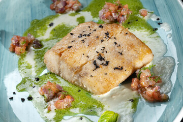 Indulge in a gourmet dish of PanSeared Fish topped with a Fresh Herb Sauce and beautiful Garnishes. Macro