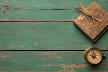 top view, green wooden background on which lies a compass, a globe and a world map. retro flatley. place for the text