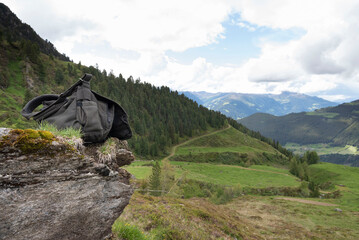 Backpack Resting on a Cliff Overlooking the Zillertal Valley, Tirol, Austria