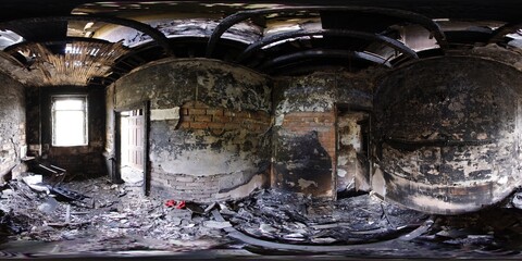 360 Degree panoramic sphere photo taken of an extremely run down property that has has a massive fire showing the burnt walls ceiling floors in the kitchen of the fire damaged house