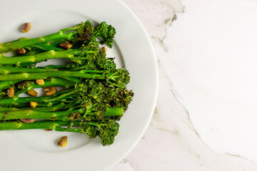 Fototapeta premium Top view of a plate with broccolini