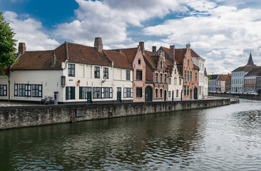 Traditional medieval houses in a row at the canals of Bruges, Flanders, Belgium