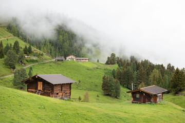 Foggy Alpine Cabins in the Green Hills of Zillertal, Austria