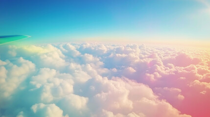 Fototapeta premium Blick vom Flugzeug über Wolken und strahlend blauen Himmel