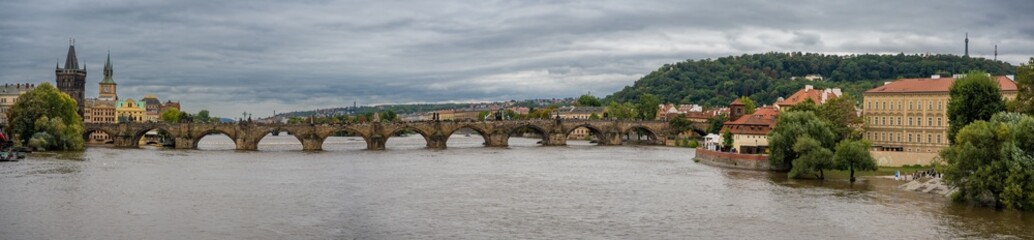 Obraz premium Flood in Prague. View of Charles Bridge over the flooding river Vltava, Prague