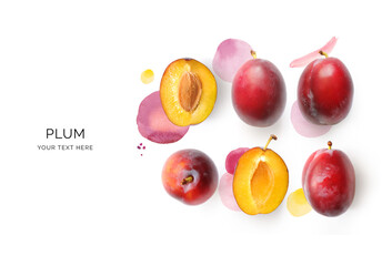 Creative layout made of plums and watercolor spots on the background. Flat lay. Food concept. Lemon...