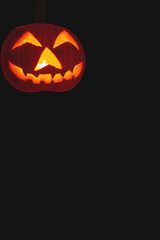 Halloween pumpkin on black background with copy space for text or design