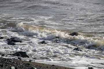 ocean wave breaking on the coast