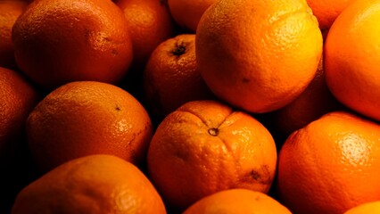 Fresh oranges beautifully lit on counter, close-up of vibrant citrus fruits with healthy nutrition concept perfect for food photography, summer fruit, organic, vitamin c rich, bright citrus freshness