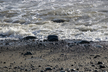 close up of waves on a rocky beach