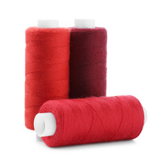 Spools of colorful sewing threads isolated on white