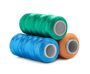Spools of bright sewing threads isolated on white