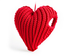 Knitted heart made of red wool threads. light white background.