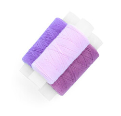 Spools of bright sewing threads isolated on white, top view