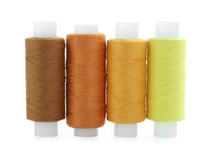 Spools of bright sewing threads isolated on white