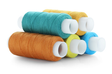 Spools of bright sewing threads isolated on white