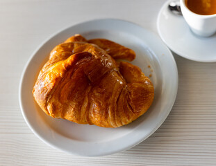 Croissant is very popular product of French cuisine, served for breakfast with coffee