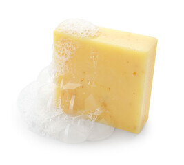Yellow soap with foam on white background