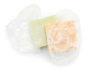 Soap bars with foam on white background, top view