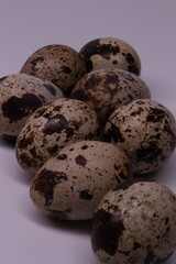 Obraz premium quail eggs on a black background