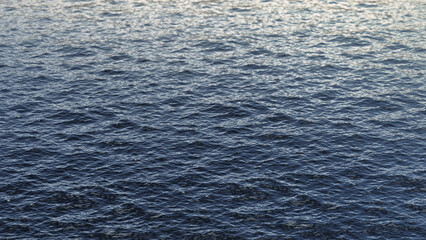 Blue sea water background texture, side view