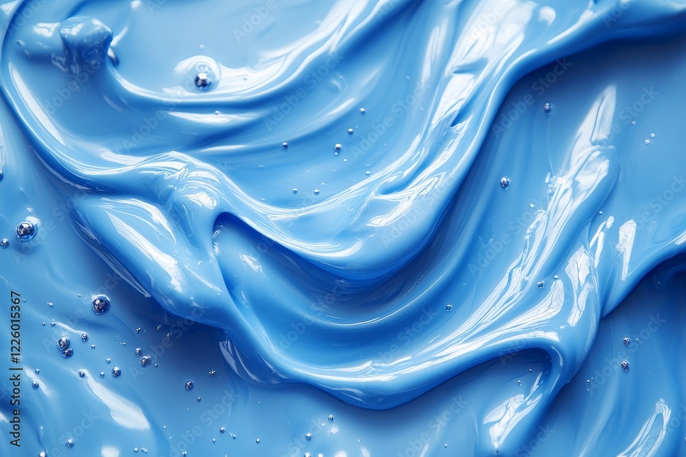 Aufkleber Swirling blue paint creates a mesmerizing texture with glossy surfaces and soft waves under bright light