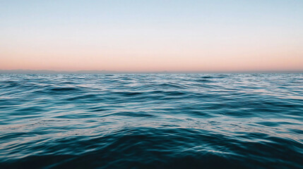 Obraz premium Tranquil ocean waves under a pastel sunset sky, evoking calmness and serenity, perfect for relaxation