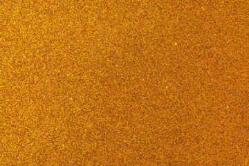 A gold colored background with a lot of small dots
