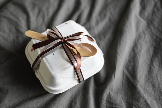 Elegant bento birthday cake packaged in a takeout box