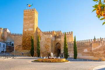 Obraz premium The Alcazar de la Puerta de Sevilla Moorish castle fortress in the Andalusian town of Carmona, Spain. 