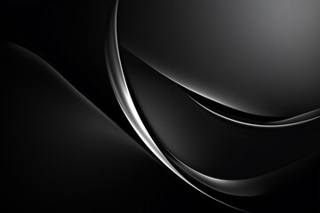 Abstract black and silver wave patterns creating a sleek, modern design with smooth textures
