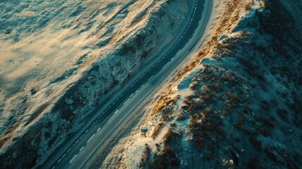 Winding Asphalt Road Cuts Through Rugged Terrain, Aerial View Landscape Photography