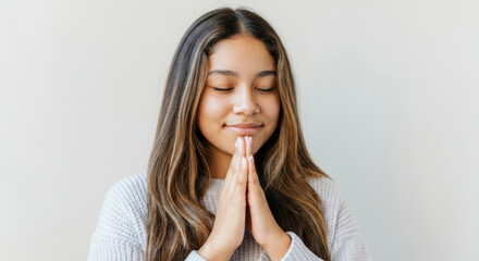 Fototapeta premium Woman with long brown hair is praying